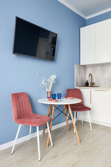 Stylish studio apartment interior with comfortable beige sofa