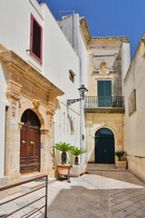 Fototapeta na wymiar Entrance arch in a old house in Presicce, a village in the Puglia region in Italy.