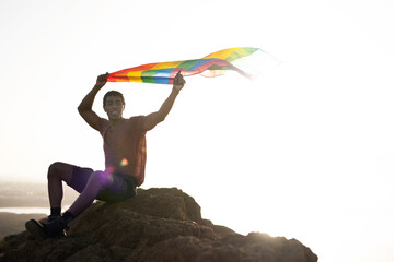 Obraz na płótnie Canvas Happy man with a pride flag. LGBT community