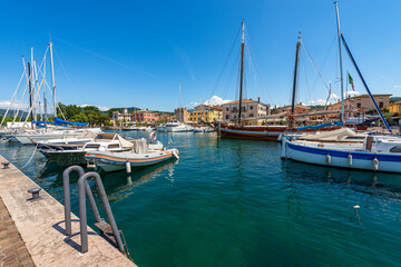 Small port of the village of Bardolino with many boats moored. Tourist resort on the coast of Lake...