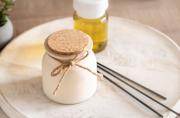 Air freshener and aroma candle on table. Healthy lifestyle and interior decor elements, cozy atmosphere at home