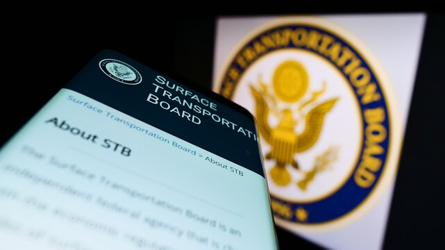 Stuttgart, Germany - 06-11-2022: Mobile phone with webpage of American Surface Transportation Board (STB) on screen in front of seal. Focus on top-left of phone display.