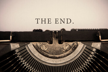 The end text typed on an old vintage typewriter. Conceptual