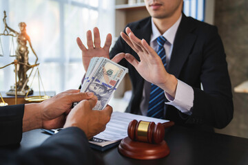 lawyer or judge is refusing bribes. In the client's courtroom at the lawyer's office In order to...