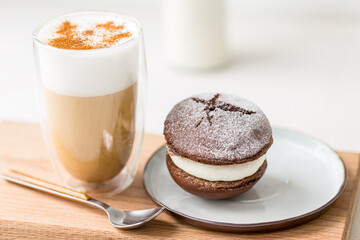 Closeup on whoopie pie and latte coffee on white background