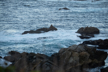 waves crashing on rocks