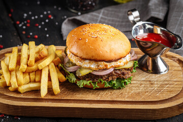 Portion of burger set with potato fries and ketchup
