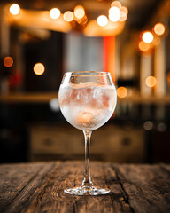 Side view on glass of fresh gin tonic alcohol cocktail