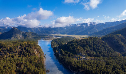 Beautiful sunrise landscape on river Katun Altai Russia. Mountains are covered with fog aerial top view