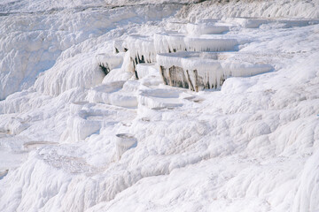 Fototapeta na wymiar Natural travertine pools pool without water drought and terraces in Pamukkale Turkey