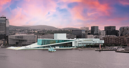 Oslo, Norway - June 6th 2022: The Oslo National Opera House by the water on a summers evening. - obrazy, fototapety, plakaty