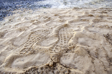 Footprints of soles in the sand