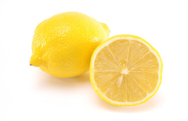 Whole and cut in half of lemon isolated on white background