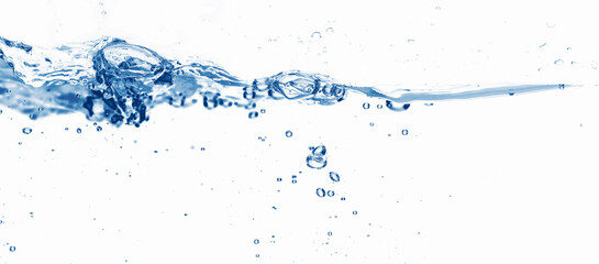 closeup of an isolated waterline wave with water bubbles and drops on white background, abstract water background concept for moisturizer, pharmacy or sustainable water resource