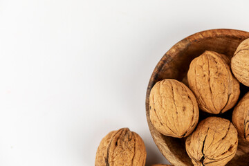 walnuts in a bowl on a white