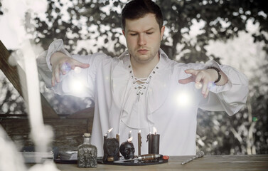 Man wizard with magical stuff. Halloween concept, masquerade or cosplay Medieval men's look
