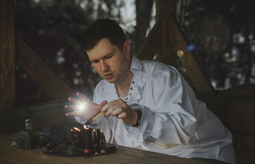 Man wizard with magical stuff. Halloween concept, masquerade or cosplay Medieval men's look