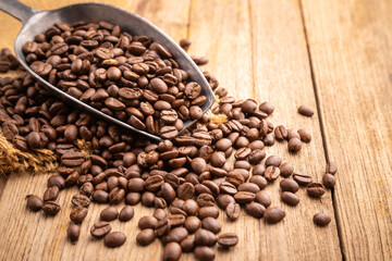 Coffee bean on wooden table background. Food and beverage concept