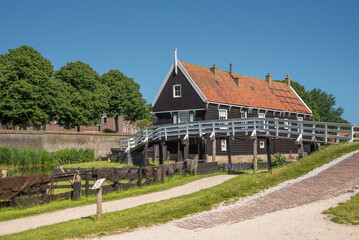 Fototapeta na wymiar Enkhuizen, Netherlands, June 2022. The old fishermen's cottages at the Zuiderzee Museum in Enkhuizen.