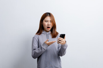 Fototapeta premium Beautiful Asian woman gesturing for advertisement editing on isolated background, portrait concept used for advertisement and signage, isolated over white background, copy space.