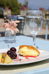 Sweet pie served with fruits on the restaurant table
