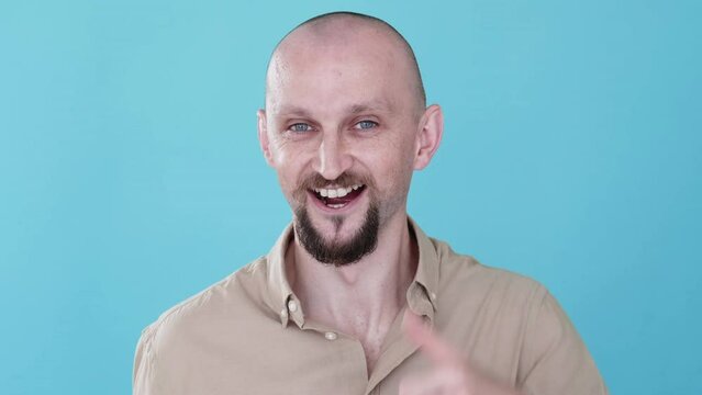 Satisfied man. Super gesture. Boomerang animation. Good feedback. Joyful happy funny guy recommending with thumb up like gif loop isolated on blue copy space background.