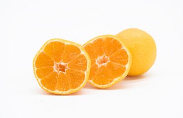whole and slice Tangerine or kamala over on white background.
