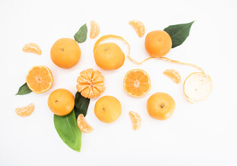 Tangerine or orange with leaf design isolated on white background,top view