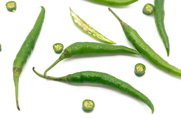 whole and slices lumbre green chili pepper isolated on white background top view