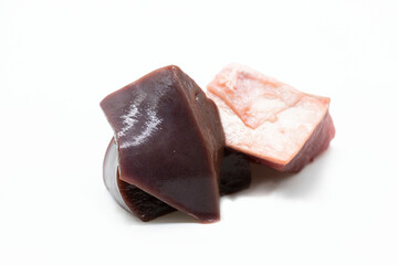 Pile of beef cube and beef liver isolated on white background