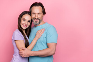 Photo of two peaceful positive people embrace toothy smile isolated on pink color background