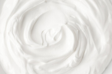 White cheese cream. White mousse texture. Yogurt ice cream background. Tasty liquid texture of sour cream.  Creamy dairy product. Curl of yogurt.