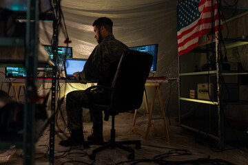 American hacker in military unifrorm on dark web, cyberwar concept.