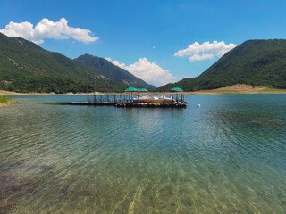 Beautiful beach in the lake Lago del Turano during sunny day of June in Lazio Italy