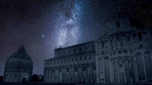 Milky way and falling stars over monuments in Pisa, timelapse