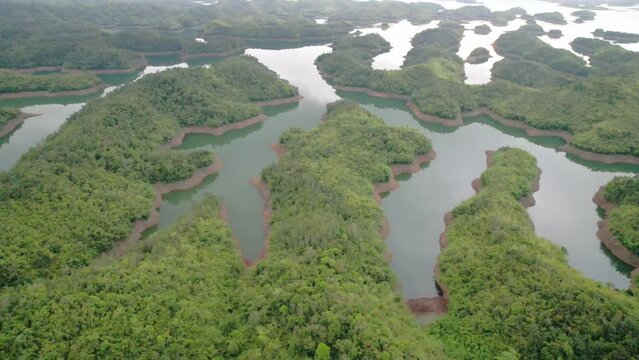 Ta Dung lake seen from above in the morning with small islands of paradise with beautiful abstract shapes. This is the reservoir for increase in Dac Nong, Vietnam.