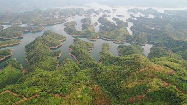 Ta Dung lake seen from above in the morning with small islands of paradise with beautiful abstract shapes. This is the reservoir for increase in Dac Nong, Vietnam.