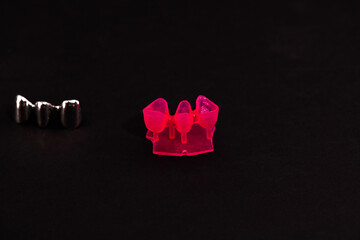 Teeth implant and crown installation process parts isolated on a black background. Medically accurate 3D model. 