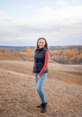 woman in the autumn forest in mountaince