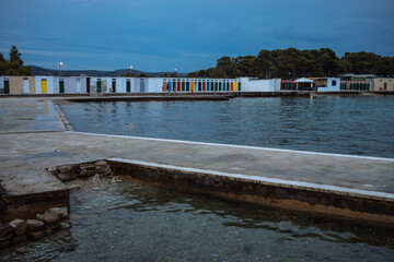 colorful doors of changing rooms built during communism in Jadrija Beach on the Adriatic coast near Sibenik