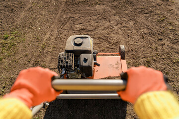 Close-up of aerator machine in the meadow