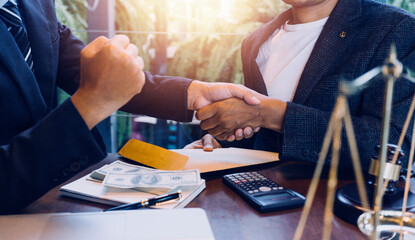 Justice and law concept.Male judge in a courtroom with the gavel, working with, computer and...