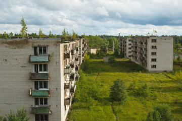 Exterior of abandoned apartment buildings in european ghost town.