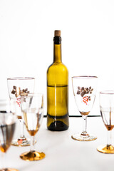 bottle of wine and glasses on a white background