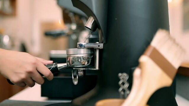 Closeup Barista workflow making iced latte in a coffee shop from professional machine, small business, startup business.