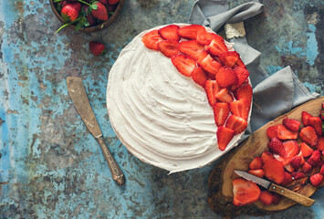 Freshly made strawberry cake on the rustic background	 - 511271878