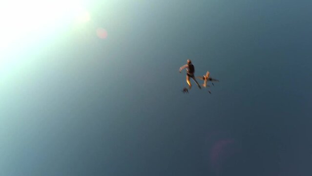 skydiving a group of skydivers jumps at sunset