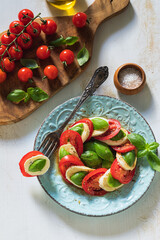 Fresh Italian Caprese Salad on Wooden Background