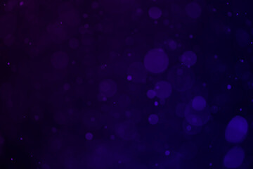 Dark purple bokeh glitter background.
