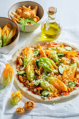 Ingredients for healthy pizza made of fresh and summer vegetables.